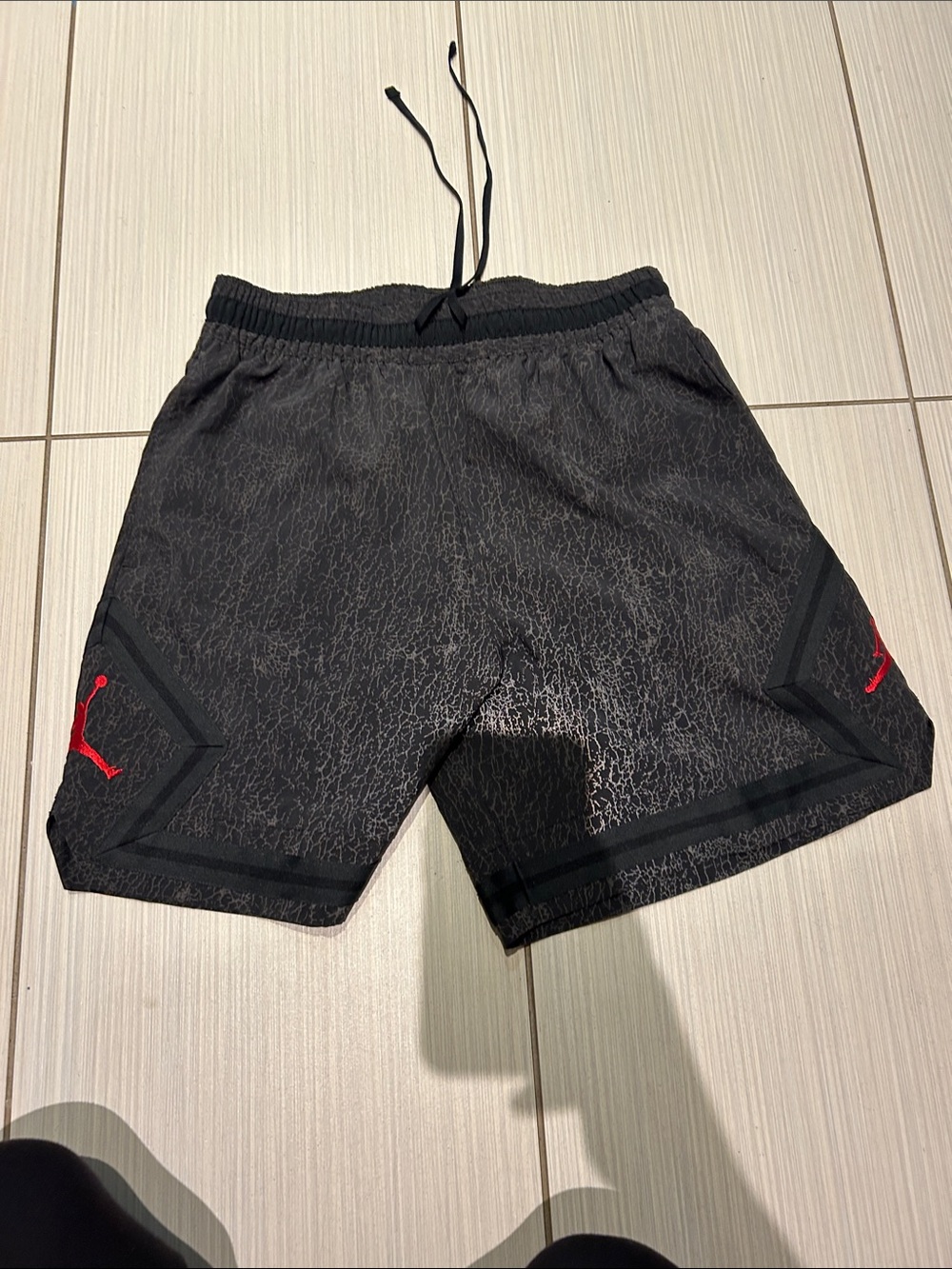 Nike Men's Black Athletic Shorts with Red Logo
